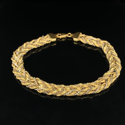 BRACELET in yellow and white gold (750‰)...