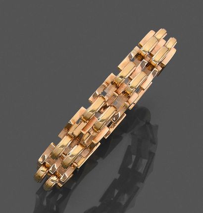  BRACELET "Tank" in pink gold (750‰) with openwork, domed and pyramidal motifs. Safety...
