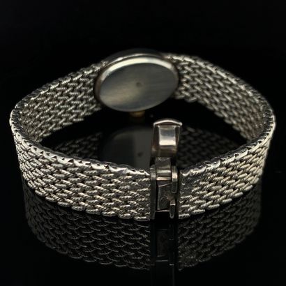 null LOT in silver (min. 800‰) comprising:
- a lady's oval WATCH BRACELET. Satin-finished...