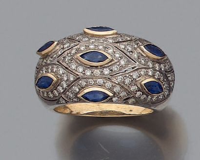 null 9-karat yellow gold (375‰) and silver (800‰) domed ring set with seven navette-shaped...