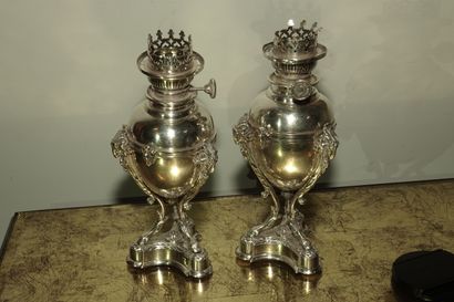 null PAIR OF PETROLEUM LAMPS in the form of silver plated cassolette, the tripod...