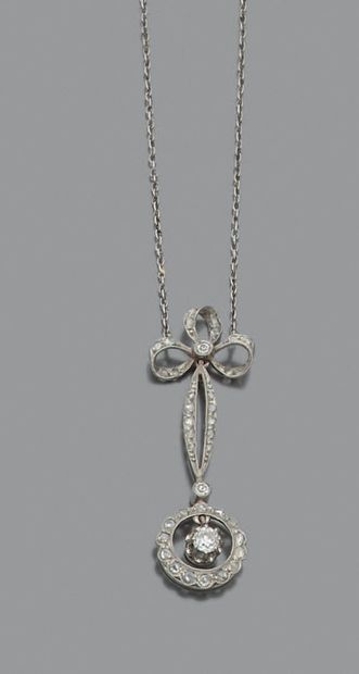 null Platinum (min. 800‰) and white gold (750‰) "knot" pendant and chain set with...