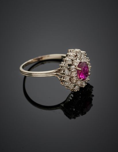 null White gold (750‰) "pompadour" ring set with an oval-shaped ruby (chips), in...