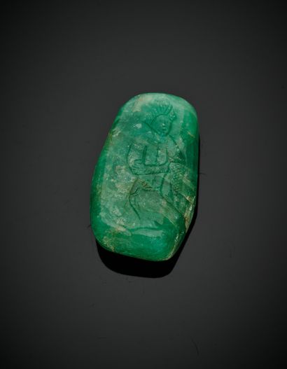 null Important polished and engraved emerald with a full figure and an oriental inscription...