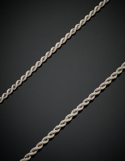 null Two white gold (750‰) twisted CHAINS.
Length : 46 and 60 cm - Weight : 12 and...