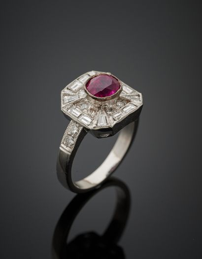 null White gold (750‰) octagonal ring set with an oval-shaped ruby, surrounded by...