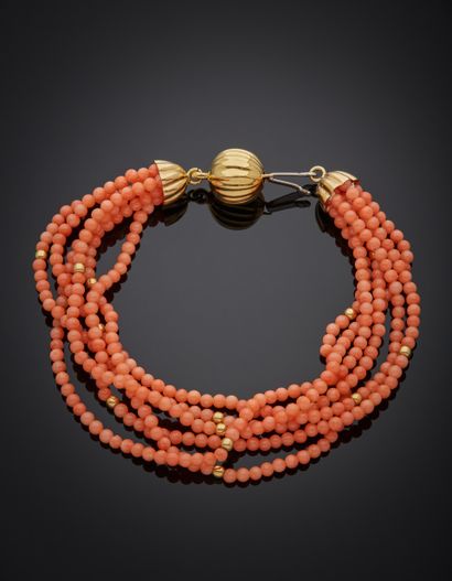 BRACELET composed of six rows of coral beads...