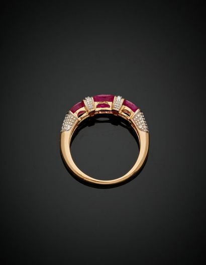 null Yellow gold and white gold (750‰) "rush" ring set with three rubies, alternated...