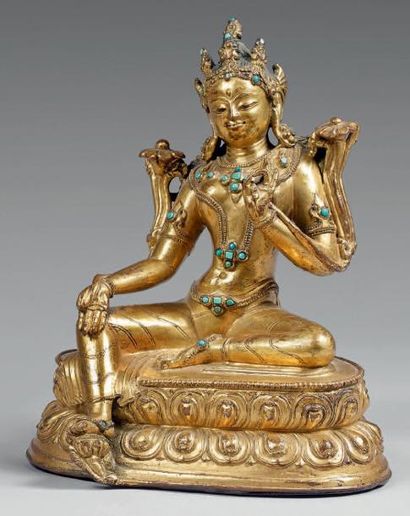 TIBET - XVIIIe siècle Statuette de Tara verte en bronze doré et incrustations de...