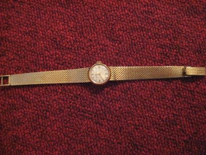 null Montre bracelet de dame en or jaune 18K 750 millièmes, la montre de forme ronde,...
