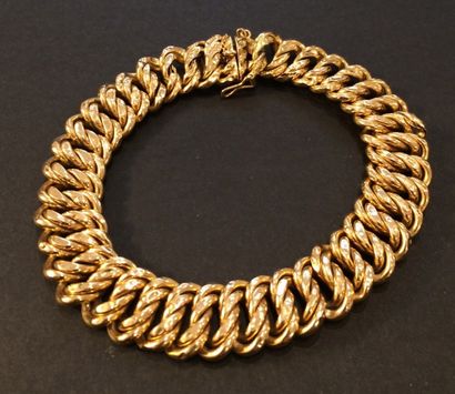 null Bracelet en or jaune (750 millièmes) à maille américaine.
(Chocs).
Long.: 19,5...