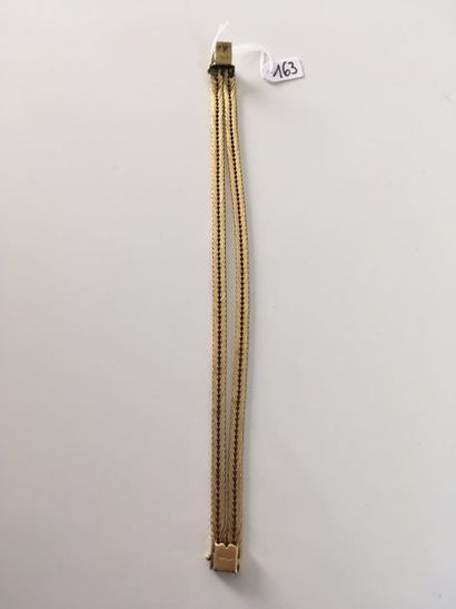 null Bracelet souple en or jaune 18K (750) à deux brins à maille chevron.
Long.:...