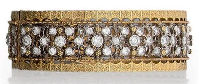 MARIO BUCCELLATI 
Rare bracelet manchette rigide ouvert en or jaune et or gris (750...