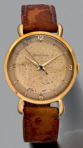 JAEGER LECOULTRE 
Bracelet-montre ronde en or jaune (750 millièmes).
Cadran deux...