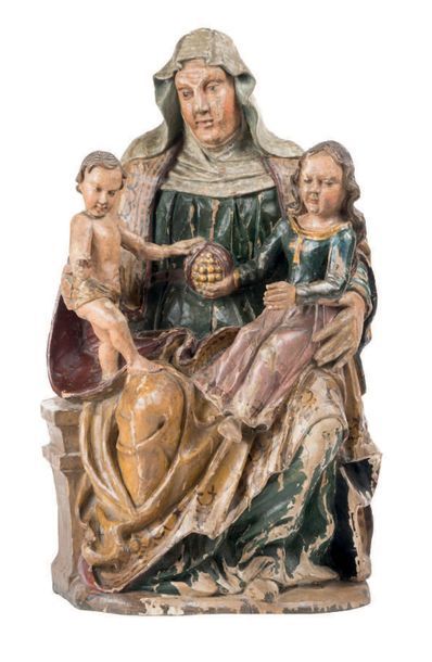 null Sainte Anne Trinitaire en bois sculpté et polychromé, dos évidé. Assise, la...