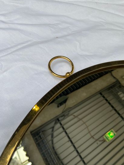 null Piero Fornasetti: Gousset mirror 

Mirror and brass 

Diameter : 49 cm 

Circa...