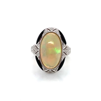BAGUE en or gris, opale, diamants et onyx White gold (750‰) ring set with a large...