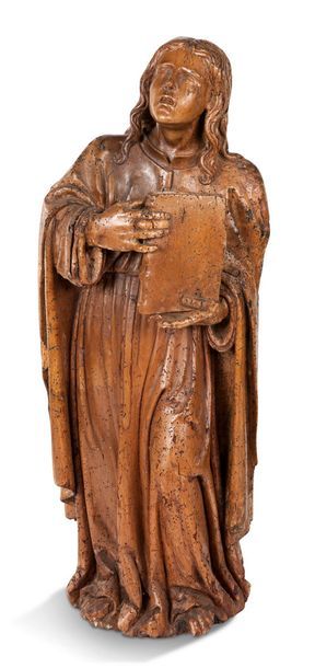 null SCULPTURE en bois naturel sculpté représentant un saint lisant.
France, XVIIe...