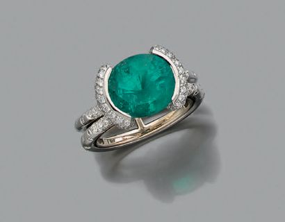MAUBOUSSIN Oval emerald, diamonds and platinum ring (850). Signed. Document and original
case...