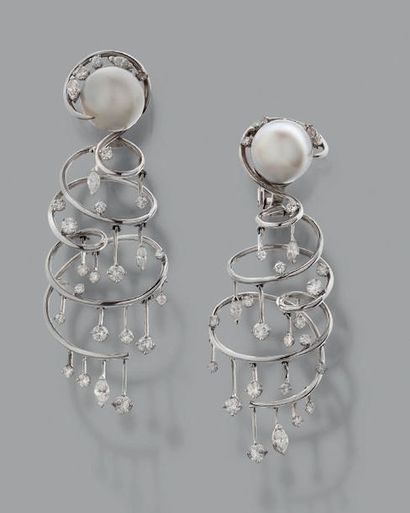 LORENZ BÄUMER Pair of articulated ear pendants.
Cultured pearls, round and shuttle...