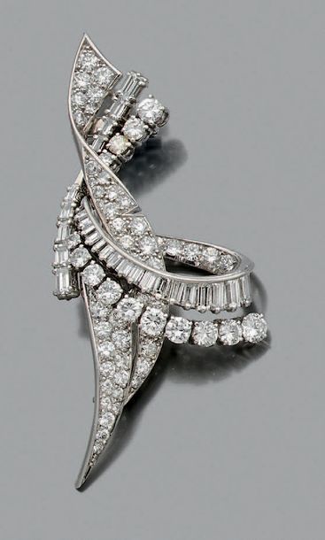 null BROCHE "VOLUTE"
Diamants ronds de taille brillant et baguette, platine (850)...
