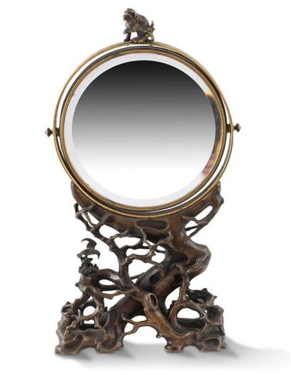 null MIRROR CIRCULAR MIRROR in bronze with brown patina surmounted by a dog of Fo...