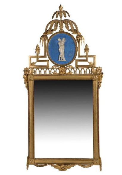 null RECTANGULAR MIRROR made of wood. Moulded, sculpted and gilded, surmounted by...