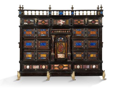 null SMALL CABINET in blackened wood, rosewood scales in brass fillet frames. The...
