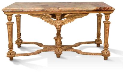 null TABLE DE MILIEU LOUIS XIV en bois sculpté et doré reposant sur quatre montants...