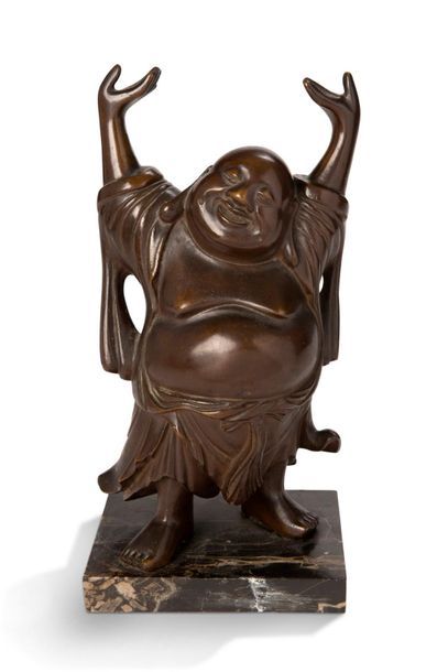 CHINE Bronze subject, representing a standing Buddha, hands raised above the head,...