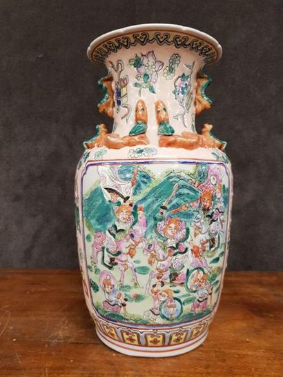 null China, circa 1970

Canton porcelain vase with scenes of characters, movable...