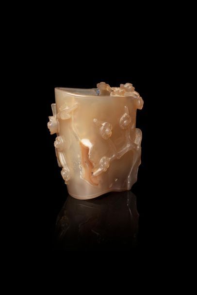 null China, 20th century

Small agate painter's bucket carved in relief of flowering...