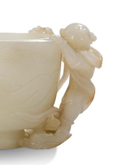 CHINE Libatory cup on pedestal, oval-shaped, made of white jade slightly infused...