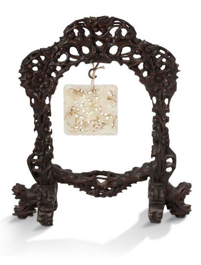 CHINE Stained wood portico supporting a finely carved and openwork white jade plaque...