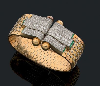 null BRACELET "BELT"
Diamonds round and old cut, calibrated emeralds, 18K gold (750)...