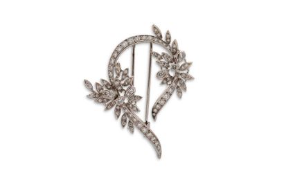 Broche Broche "florale"
Diamants et platine (850).
H.: 5.2cm env. - Pb: 17.5gr

Cliquez...