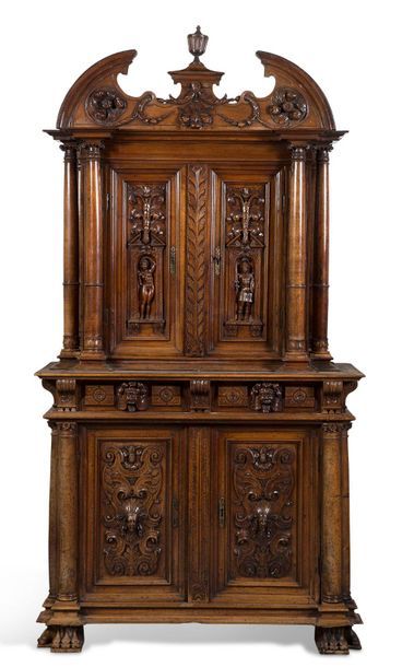 null RENAISSANCE FURNITURE with two bodies in carved moulded walnut. The upper part...