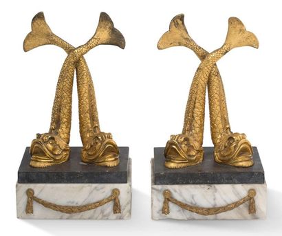Pair of chiselled gilt bronze DOUPHINS, crossing...