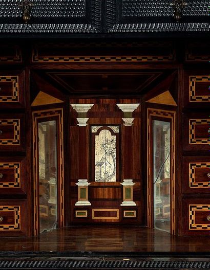 ENTOURAGE DE JEAN MACÉ Cabinet in carved and engraved ebony veneer, surmounted by...