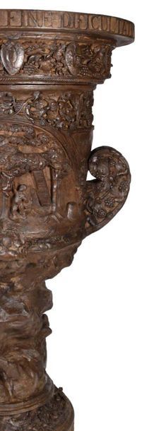 null 
LARGE WINE CREATER VASE in walnut richly carved in high relief. Its shape is...
