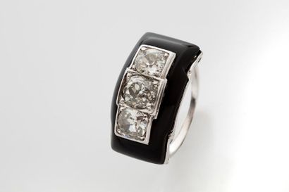 null RING "DIAMONDS"
Old cut diamonds, onyx, platinum (950) and 18K gold (750). French...