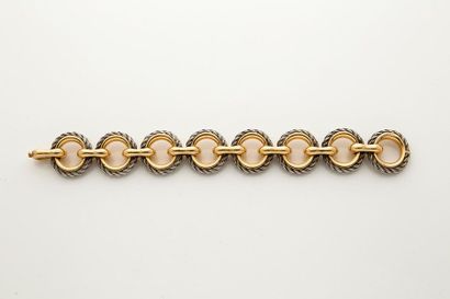 VAN CLEEF & ARPELS Bracelet deux ors 18K (750).
Signé et numéroté. Vers 1970. Écrin.
L.:...