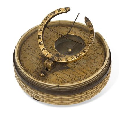 null ~Charming gilt brass equatorial sundial in a cylindrical ivory wickerwork box...