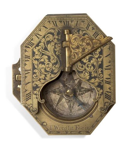 null Interesting reclining brass sundial engraved with foliage, with a compass, signed...