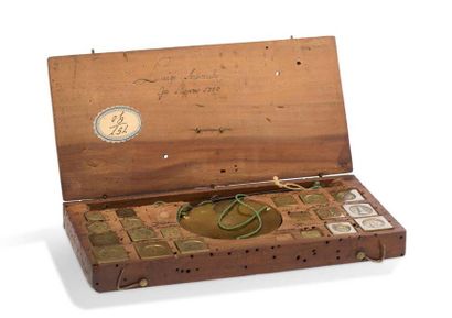 null Fine German assay balance contained with its weights in a fruit wood box with...