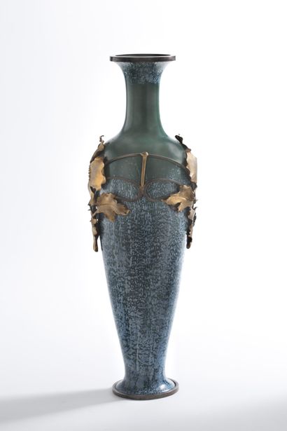 TRAVAIL ANONYME BALUSTER VASE In glazed earthenware, decorated with cut out brass...
