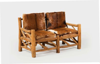 TRAVAIL ANONYME SMALL NATURAL WOODEN LOG SOFA with cow skin cushions.
Height 81.5...