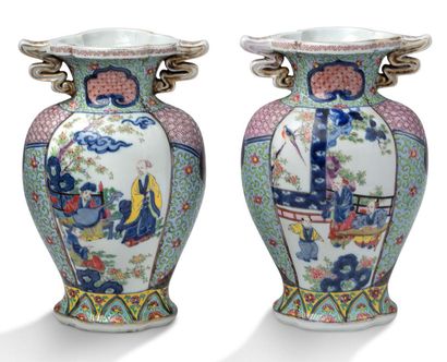 EUROPE 
A pair of polychrome enamelled porcelain vases decorated with characters...