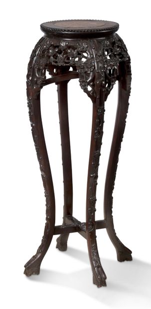 CHINE 
A large ironwood sellette with openwork and carved five-petal flowers, topped...