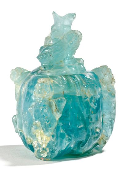 CHINE 
A blue beryl covered vase carved in the shape of a melon and foliage, on which...